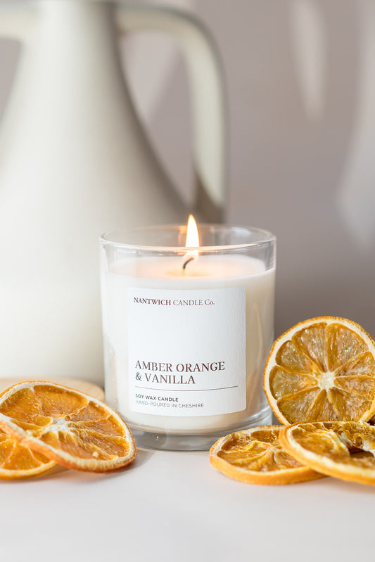 An amber orange & vanilla Scented soy wax candle subscription box